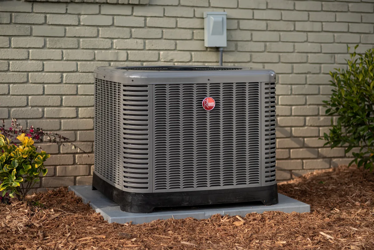 Technician servicing HVAC equipment