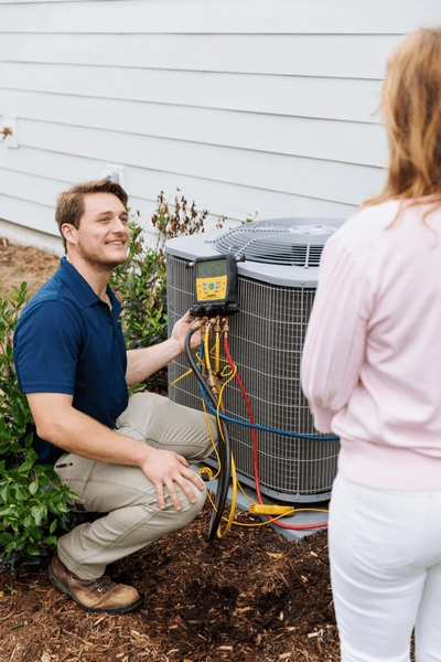 All American hvac technician maintaining AC